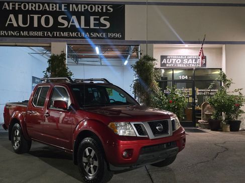 Used 2013 Nissan Frontier PRO-4X image 1