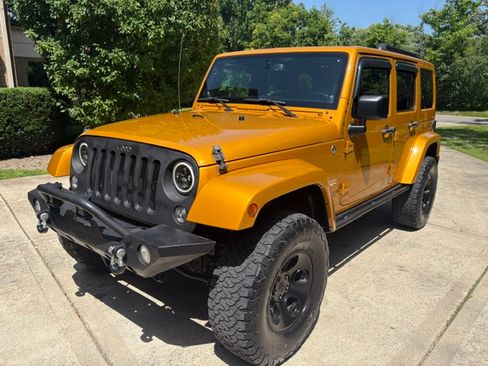 Used 2014 Jeep Wrangler 4WD Unlimited Sahara image 1