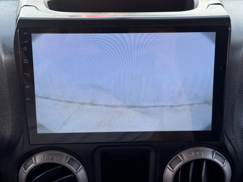 Used 2013 Jeep Wrangler Unlimited Sport w/ Mopar Black Appearance Group image 22