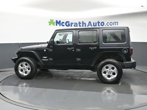 Used 2014 Jeep Wrangler Unlimited Sahara w/ Dual Top Group AWD/4WD image 22