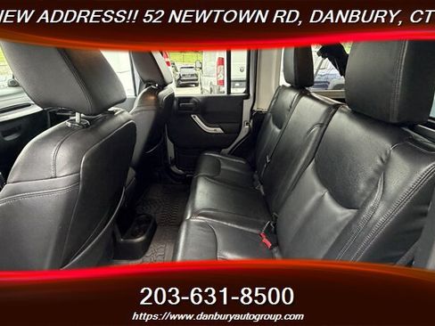 Used 2014 Jeep Wrangler Unlimited Sahara w/ Dual Top Group AWD/4WD image 19