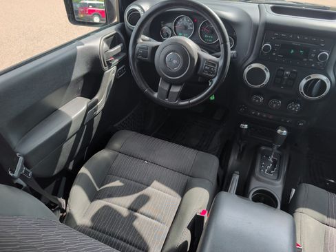Used 2012 Jeep Wrangler Unlimited Sahara w/ Dual Top Group AWD/4WD image 9