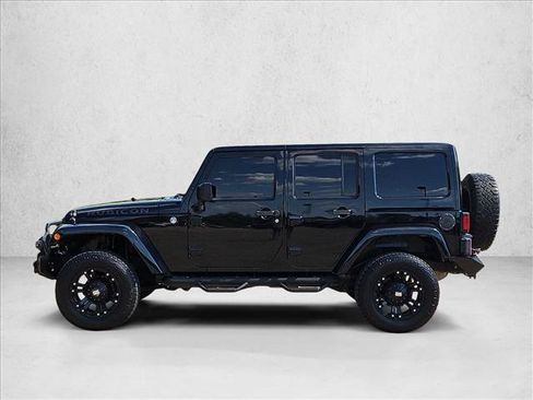 Used 2012 Jeep Wrangler Unlimited Rubicon w/ Dual Top Group AWD/4WD image 9