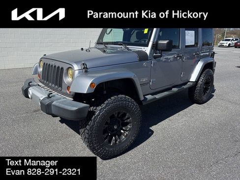Used 2013 Jeep Wrangler Unlimited Sahara w/ Dual Top Group AWD/4WD image 1