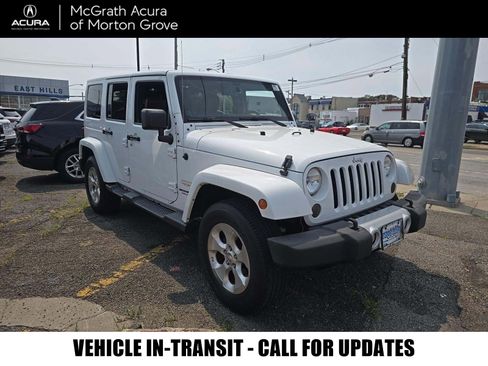 Used 2014 Jeep Wrangler Unlimited Sahara w/ Max Tow Package AWD/4WD image 1