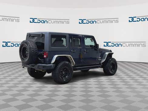 Used 2013 Jeep Wrangler Unlimited Sahara w/ Dual Top Group AWD/4WD image 8