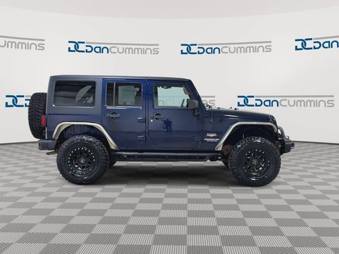 Used 2013 Jeep Wrangler Unlimited Sahara w/ Dual Top Group AWD/4WD image 9