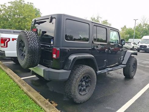 Used 2014 Jeep Wrangler Unlimited Sahara w/ Dual Top Group AWD/4WD image 8