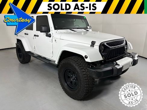 Used 2012 Jeep Wrangler Unlimited Sahara AWD/4WD image 1