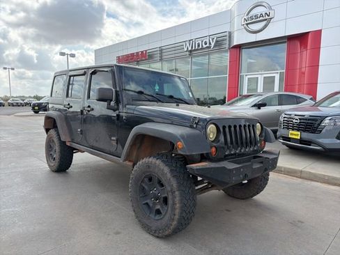 Used 2012 Jeep Wrangler Unlimited Rubicon w/ Dual Top Group image 1