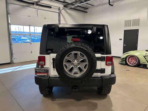 Used 2014 Jeep Wrangler Unlimited Rubicon w/ Dual Top Group AWD/4WD image 4