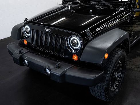Used 2012 Jeep Wrangler Unlimited Rubicon w/ Dual Top Group AWD/4WD image 11