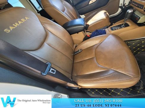 Used 2014 Jeep Wrangler Unlimited Sahara w/ Dual Top Group AWD/4WD image 21