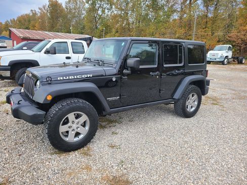 Used 2012 Jeep Wrangler Unlimited Rubicon w/ Dual Top Group image 1
