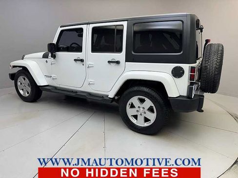 Used 2013 Jeep Wrangler Unlimited Sahara w/ Dual Top Group AWD/4WD image 3