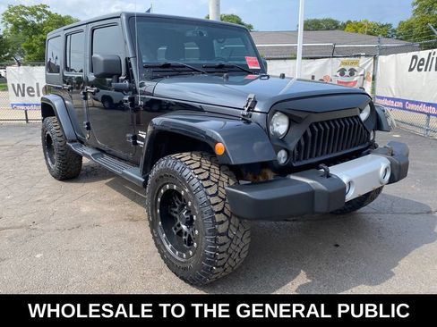 Used 2013 Jeep Wrangler Unlimited Sahara w/ Dual Top Group AWD/4WD image 1
