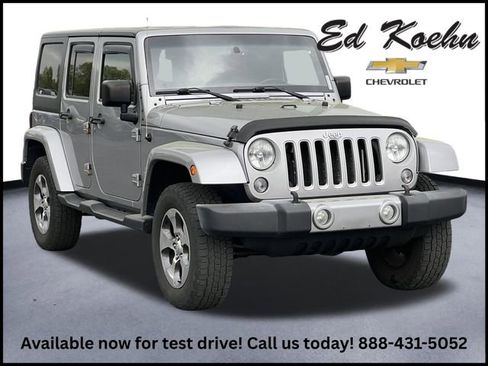Used 2016 Jeep Wrangler Unlimited Sahara w/ Dual Top Group AWD/4WD image 1