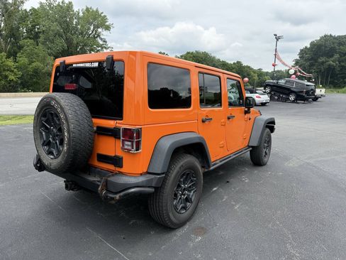 Used 2013 Jeep Wrangler Unlimited Sahara w/ Dual Top Group AWD/4WD image 9