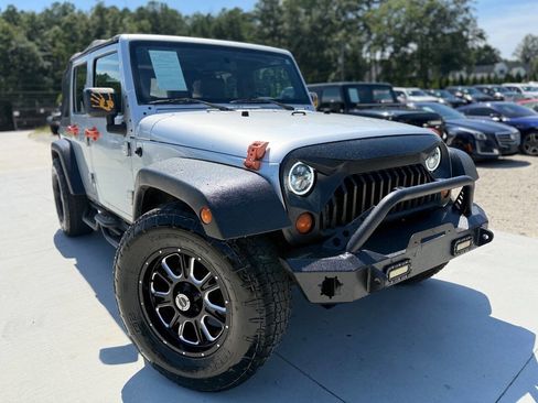 Used 2010 Jeep Wrangler Unlimited Sport image 1