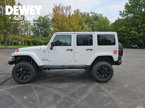 Used 2012 Jeep Wrangler Unlimited Sahara w/ Dual Top Group AWD/4WD image 1