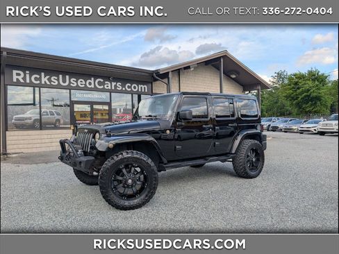 Used 2014 Jeep Wrangler Unlimited Sahara AWD/4WD image 1