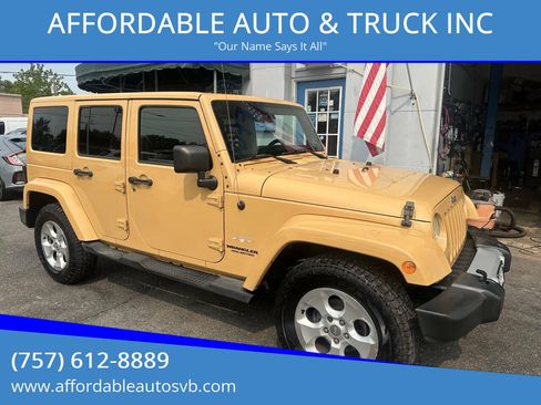 Used 2013 Jeep Wrangler Unlimited Sahara w/ Dual Top Group AWD/4WD image 1