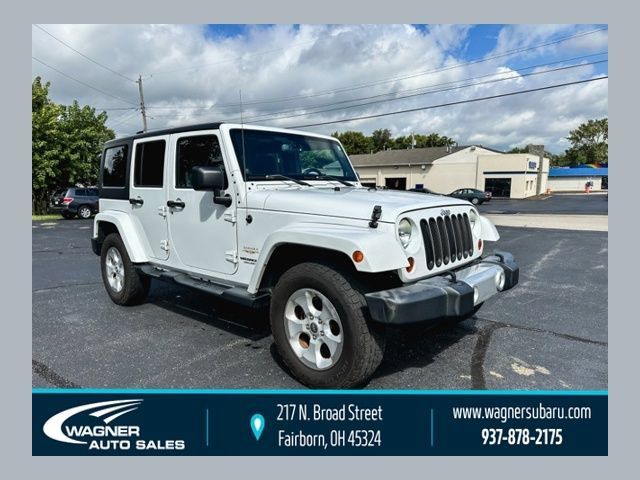 Used 2013 Jeep Wrangler Unlimited Sahara w/ Trailer Tow Group AWD/4WD image 1