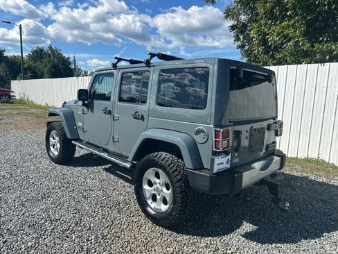 Used 2014 Jeep Wrangler Unlimited Sahara w/ Mopar Chrome Edition Group AWD/4WD image 3