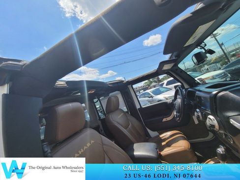 Used 2014 Jeep Wrangler Unlimited Sahara w/ Dual Top Group AWD/4WD image 19