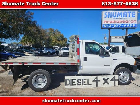 Used 2000 Ford F450 4x4 9 FT. Flatbed 7.3 Diesel image 1