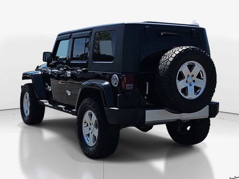 Used 2010 Jeep Wrangler Unlimited Sahara w/ Dual Top Group AWD/4WD image 6