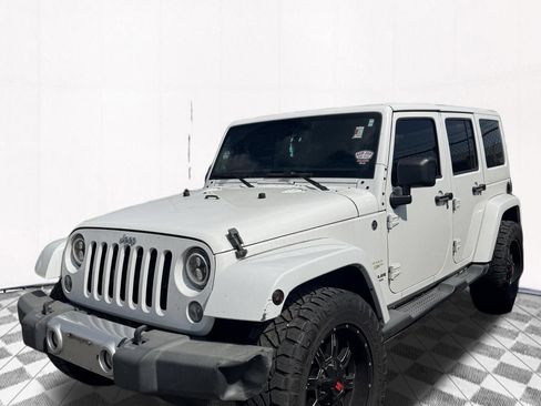 Used 2013 Jeep Wrangler Unlimited Sahara w/ Connectivity Group AWD/4WD image 1
