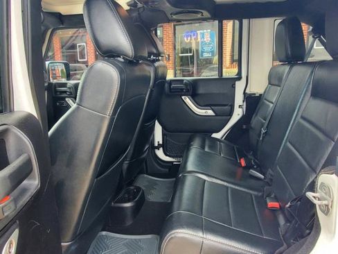 Used 2012 Jeep Wrangler Unlimited Sahara w/ Dual Top Group AWD/4WD image 16