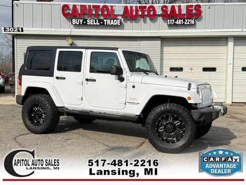 Used 2014 Jeep Wrangler Unlimited Sahara w/ Dual Top Group image 1