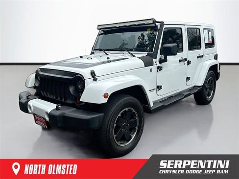 Used 2012 Jeep Wrangler Unlimited Sahara AWD/4WD image 1