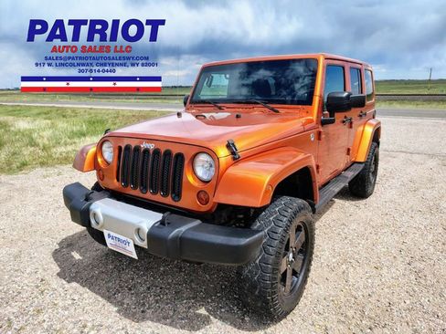 Used 2011 Jeep Wrangler Unlimited Sahara w/ Dual Top Group AWD/4WD image 1