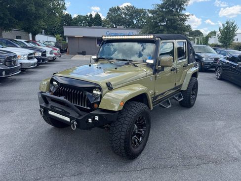 Used 2013 Jeep Wrangler Unlimited Sahara w/ Dual Top Group AWD/4WD image 1