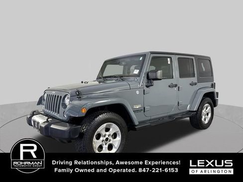 Used 2014 Jeep Wrangler Unlimited Sahara w/ Dual Top Group AWD/4WD image 2