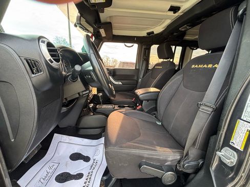 Used 2014 Jeep Wrangler Unlimited Sahara w/ Dual Top Group AWD/4WD image 16