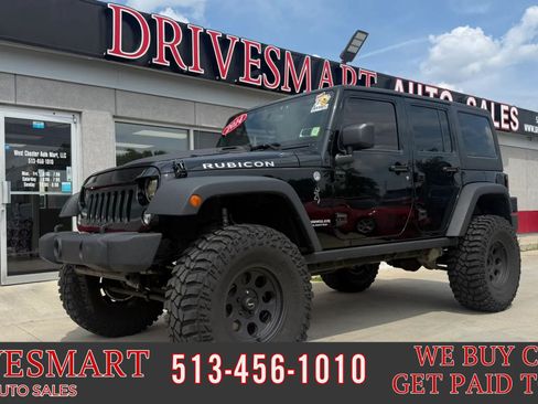 Used 2014 Jeep Wrangler Unlimited Rubicon w/ Dual Top Group AWD/4WD image 1