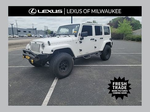 Used 2012 Jeep Wrangler Unlimited Sahara w/ Dual Top Group AWD/4WD image 1