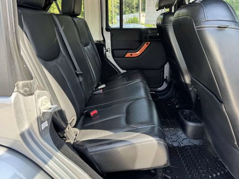 Used 2013 Jeep Wrangler Unlimited Sahara w/ Dual Top Group AWD/4WD image 14