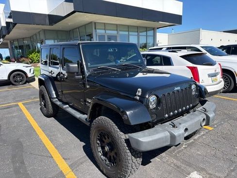 Used 2013 Jeep Wrangler Unlimited Sahara w/ Dual Top Group AWD/4WD image 1