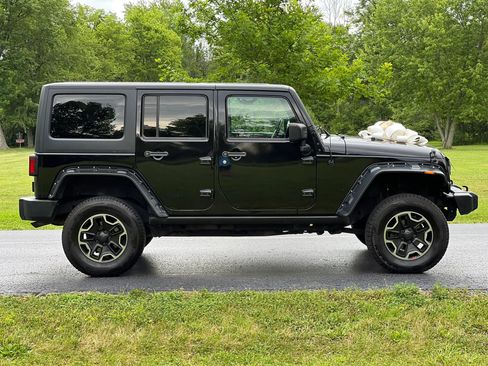 Used 2014 Jeep Wrangler Unlimited Sahara w/ Dual Top Group AWD/4WD image 4