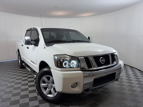 Used 2011 Nissan Titan SV w/ SV Premium Utility Pkg AWD/4WD image 1