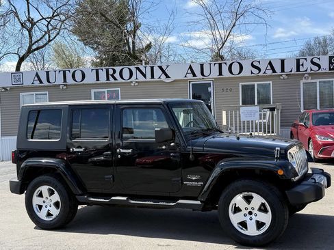 Used 2010 Jeep Wrangler Unlimited Sahara w/ Dual Top Group image 1