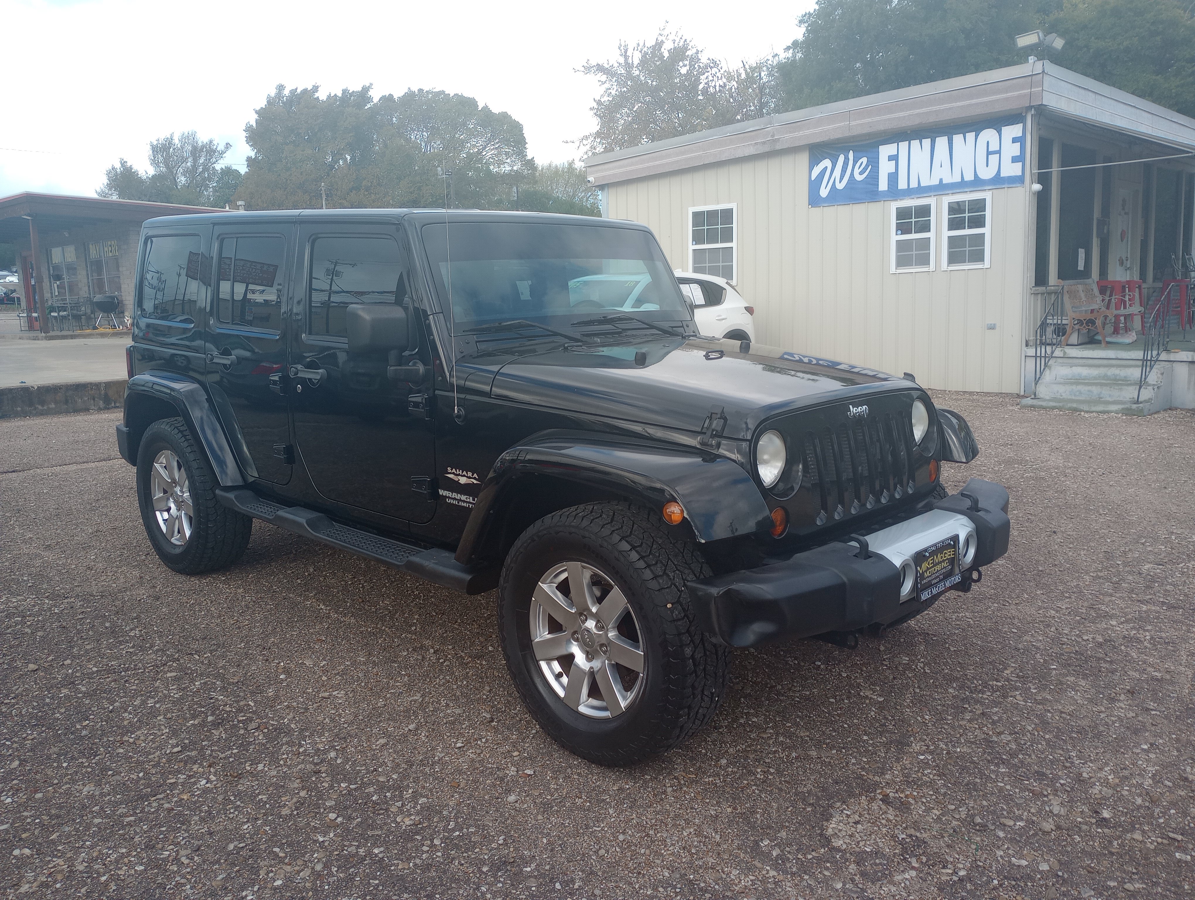 Used 2012 Jeep Wrangler Unlimited Sahara w/ Dual Top Group AWD/4WD image 1