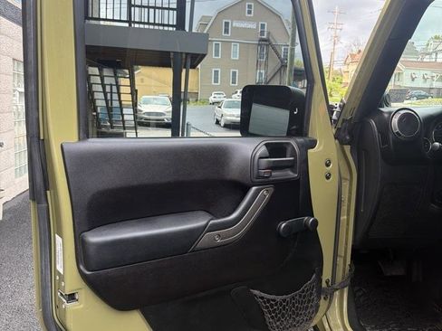Used 2013 Jeep Wrangler Unlimited Sport w/ Mopar Black Appearance Group AWD/4WD image 9