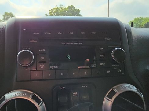 Used 2012 Jeep Wrangler Unlimited Sahara w/ Dual Top Group AWD/4WD image 12