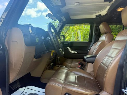 Used 2012 Jeep Wrangler Unlimited Sahara w/ Dual Top Group AWD/4WD image 11